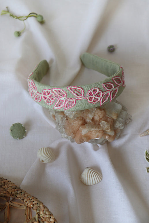 Green hairband with flower embroidery