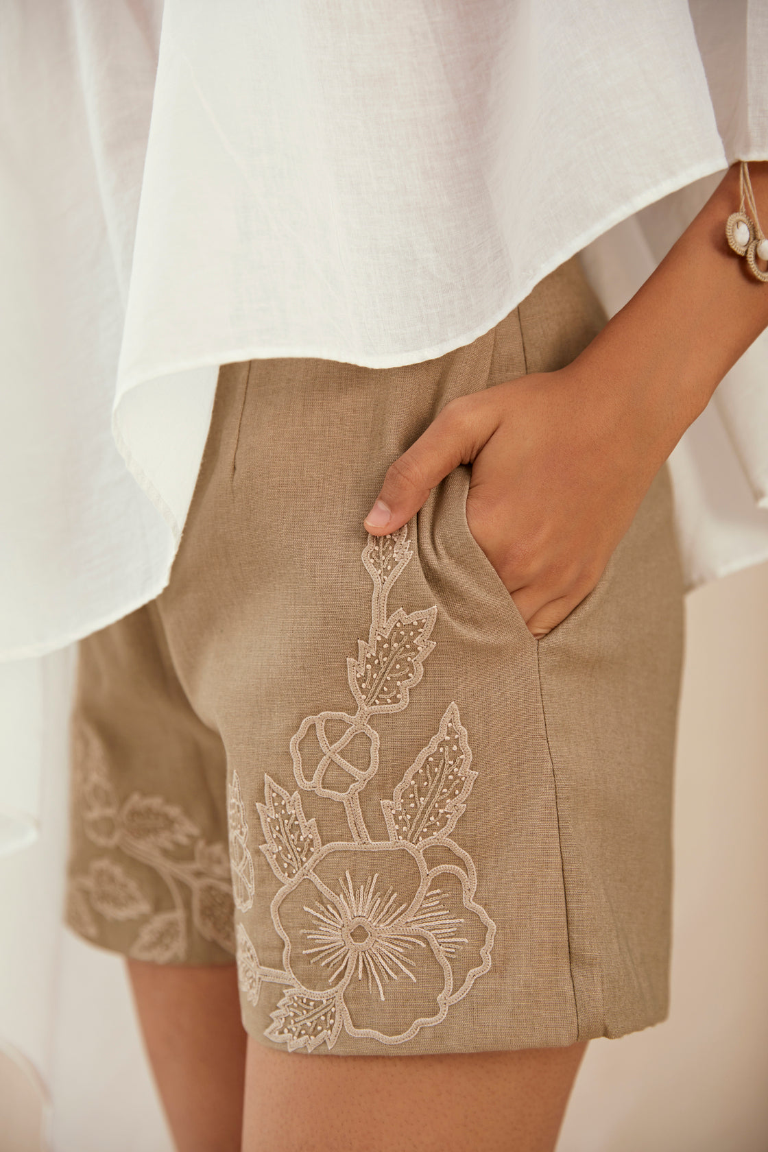 White cotton top with beige linen hand embroidered shorts